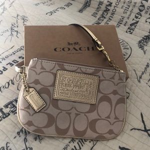 Coach gold wristlet purse